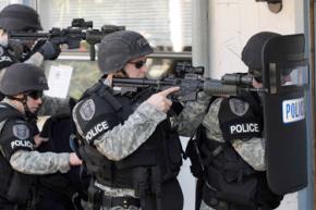 A Seattle SWAT team prepares to enter a home